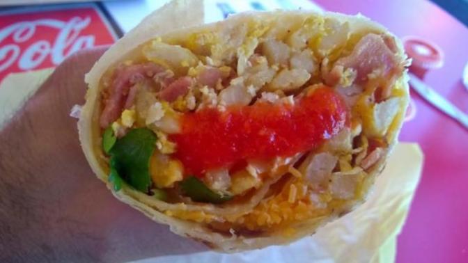 How do you apply your hot sauce on your burrito when eating? on each bite, in a dip or do you put it all on before you eat it?