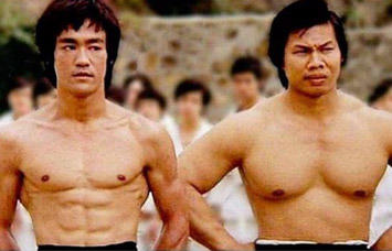 Bruce Lee (ripped) and Bolo Yeung (bulky)