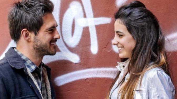 What signs do girls give when they flirt with a guy?