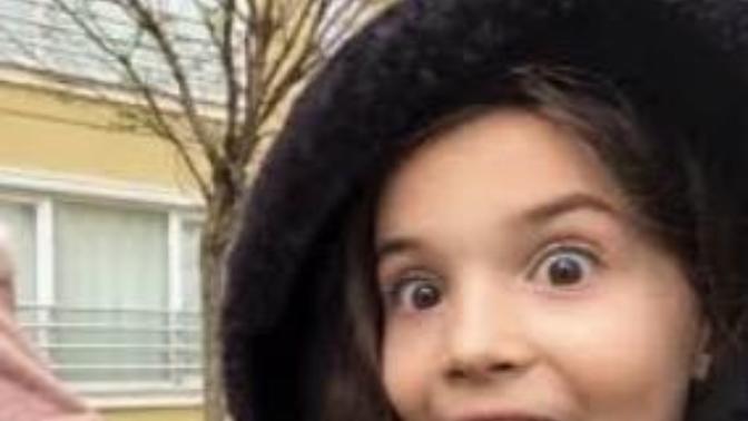 Guys, a girl with black hair, white skin and big black eyes or is this girl?