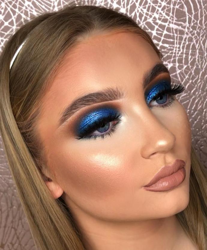 Too much makeup, looks like she filled her lips with botox