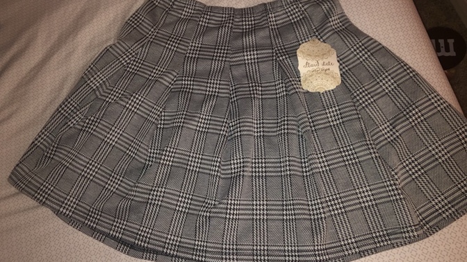 Which plaid skirt is better?
