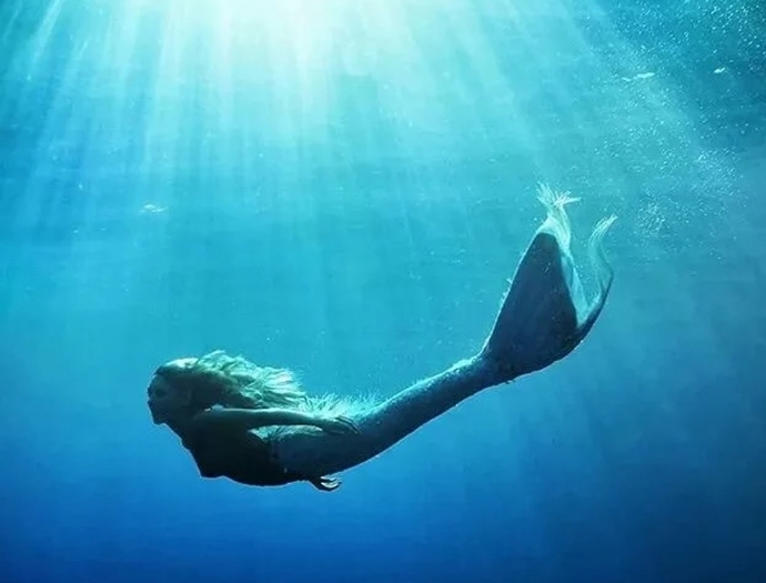 If a sea witch offered you a magic potion that would permanently transform you into a mermaid, would you take it?