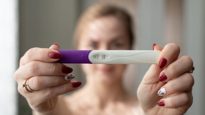 How should I surprise my fiancé by telling him I'm pregnant?
