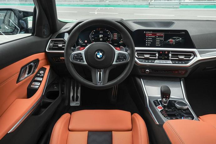 Why do men drive with one hand at the top of the steering wheel?