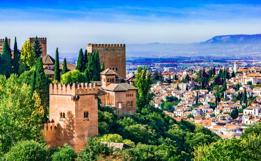 Planning a short trip to somewhere in Mediterranean Europe on budget in the summer, Greece or Andalusia (south of Spain)?