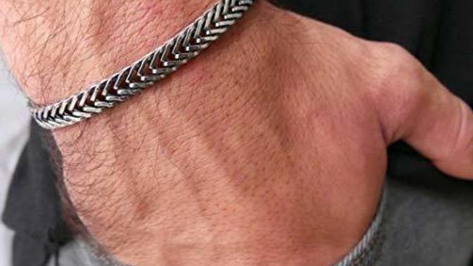 What's the more attractive accessory to put on guys' wrists?