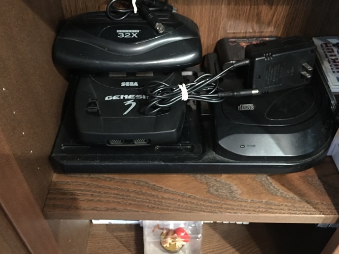 sega cd, sega genesis model 3 and the 32x on top of each other