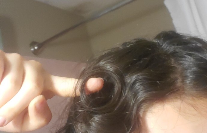 What to do when you have hair that sticks out like this what could I do to stop my hair from doing this should I cut it off?