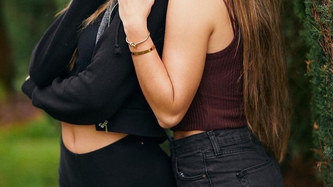 My girlfriend took this photo with her friend. Is she bisexual?