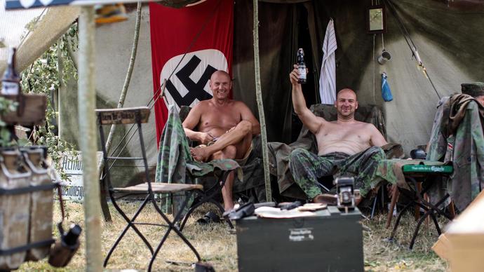 If you saw a photo of someone holding a Nazi flag, would you assume that they are a racist?