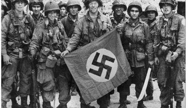 If you saw a photo of someone holding a Nazi flag, would you assume that they are a racist?