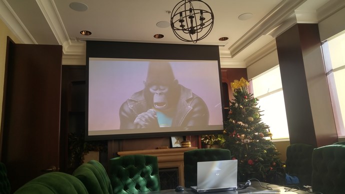 4K Projector, motorized screen, 5.1 surround, laptop feed for conference room.