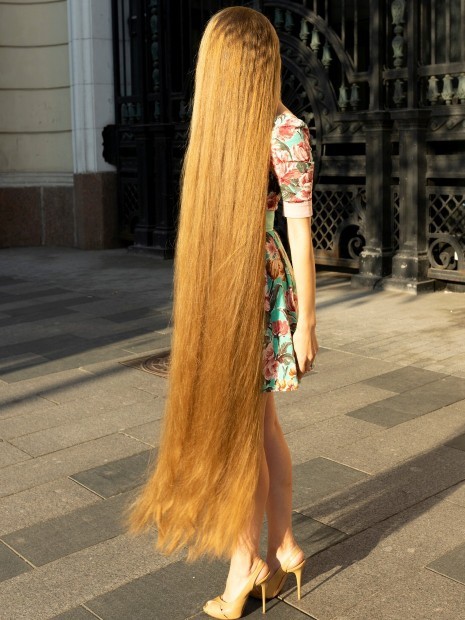 What do guys think of those women with extremely long hair? Like it or hate it?