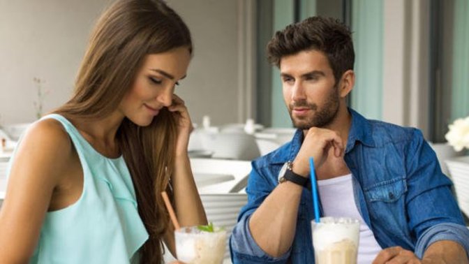 What are the signs that a girl likes you but doesn't want to show it?