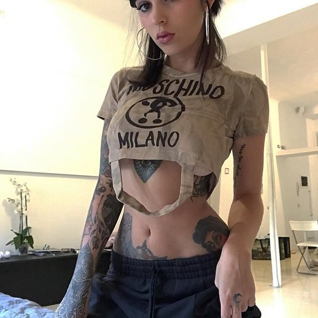Hand, arm, and breast tattoos