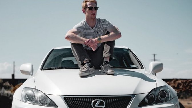 Why do guys pose with their car on a dating profile?