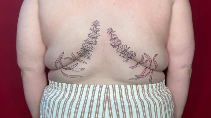 Once Your Back Fills Out, Will You Get Roll Flowers Tattooed on Your Folds?