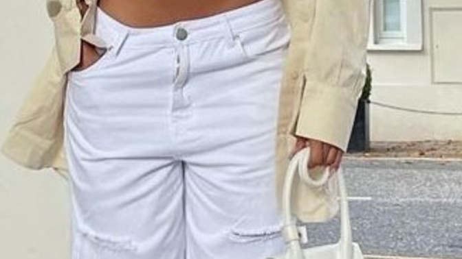 Why does her outfit look like she's in the middle of getting dressed?