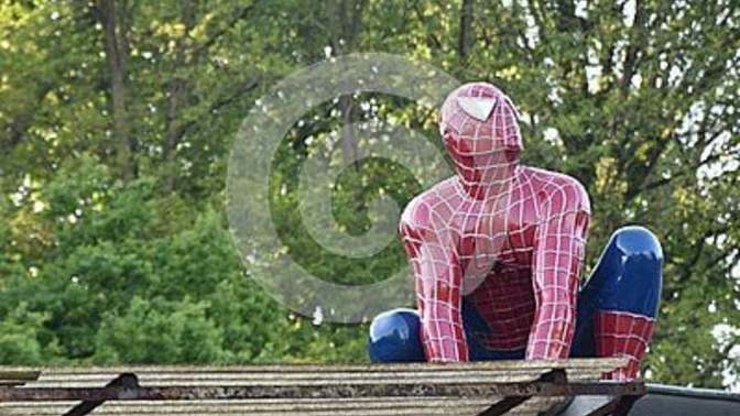 How would you react if you walked outside and caught spiderman hiding and snapping pictures ontop of your roof?