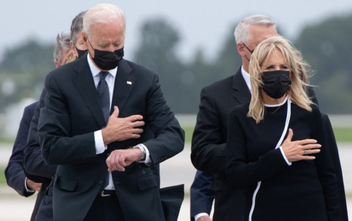 Was Biden looking at his watch during the ceremony for Marines killed in Kabul?