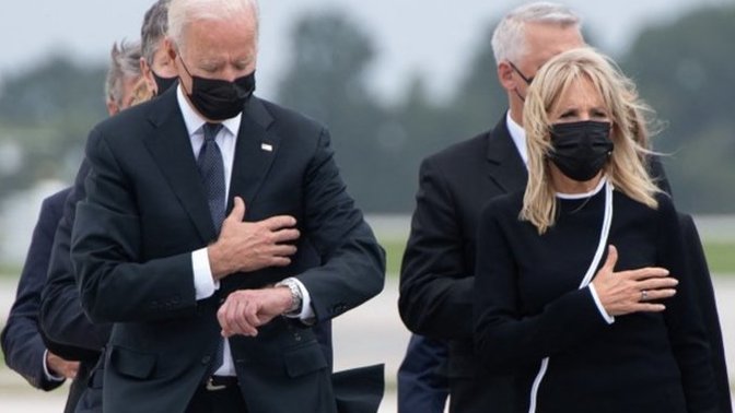 Was Biden looking at his watch during the ceremony for Marines killed in Kabul?