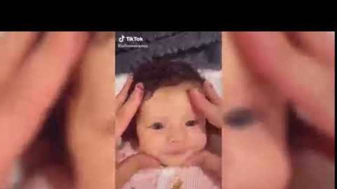 Is playing with a baby's cheek or tickling them a natural reaction?