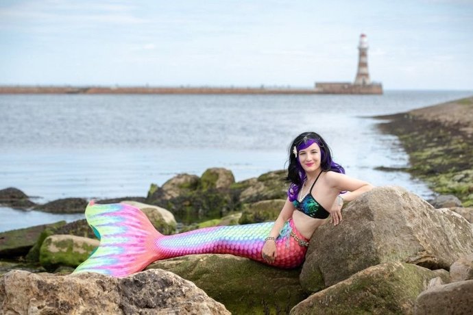 If you were walking down a remote stretch of beach and you saw a mermaid sitting on the rocks combing her hair, what would you do?