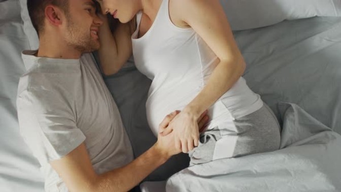 Do pregnant women like having their bellies touched while cuddling?