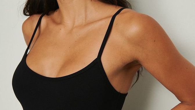 Which color of this dress would be the best choice to wear with a black leather jacket if you're pale?
