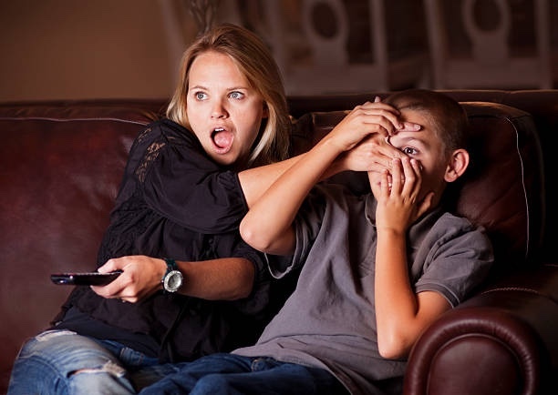 Why do parents block their kids eyes from romance scenes in movies?