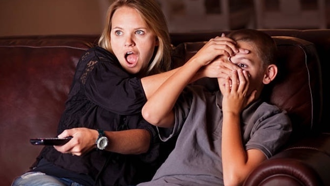Why do parents block their kids eyes from romance scenes in movies?