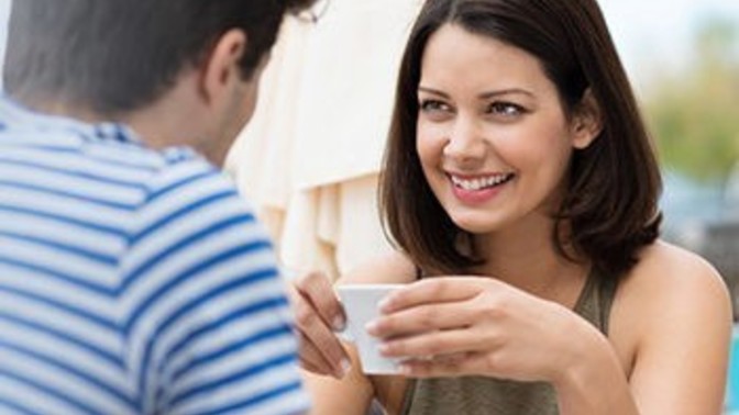 How do women typically act around someone they like?