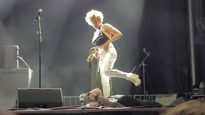 The lead singer of a rock band instructed a fan to lie down on the stage so she could urinate on him. How does this make you feel?