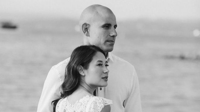 Why do Asian women often date less attractive white males?