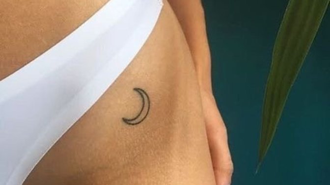 Guys, I want to get this tattoo on my back of my shoulders - is this trashy or not? And would it turn you off a girl?