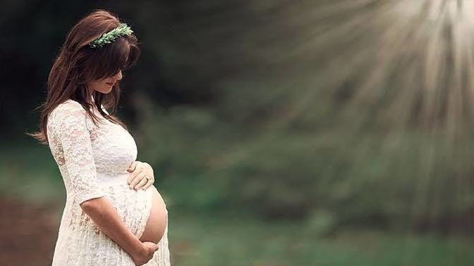 Why do pregnant women always pose holding their stomach?