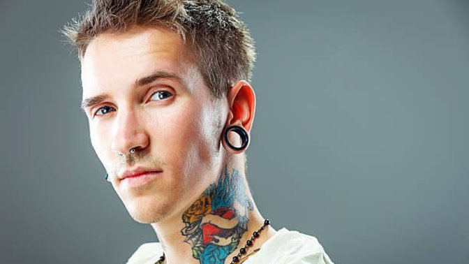 How many piercings and tattoos do you have?
