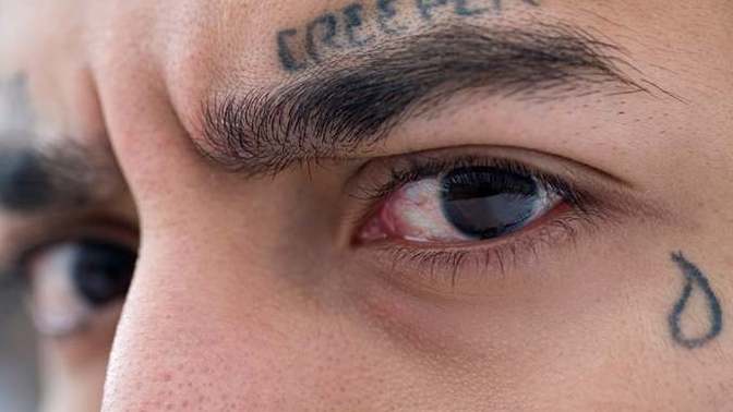 Would it bother you if your kids teacher has a tear drop tattoo/or a lot of tattoos showing on face and arms?