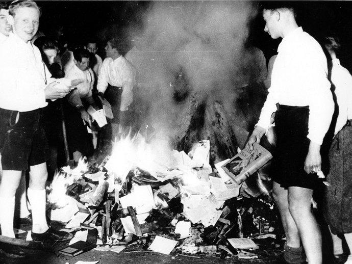 Trumpist youth burning science books.