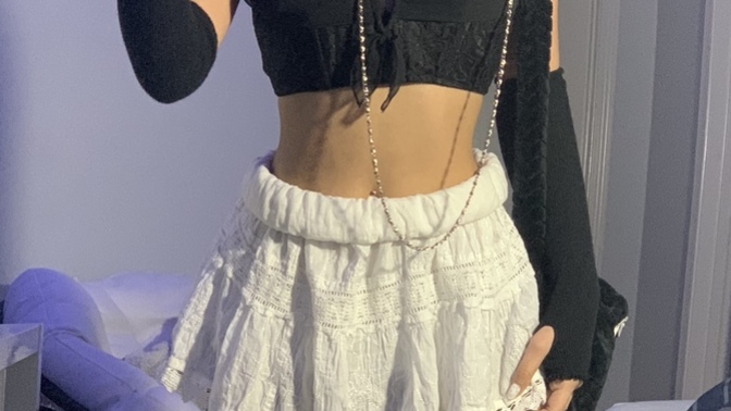 Which skirt looks better with my outfit: black or white?