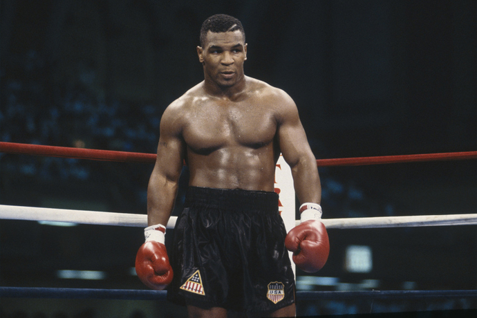 Who had a more built and powerful physique in fighting, Brock Lesnar or Mike Tyson?