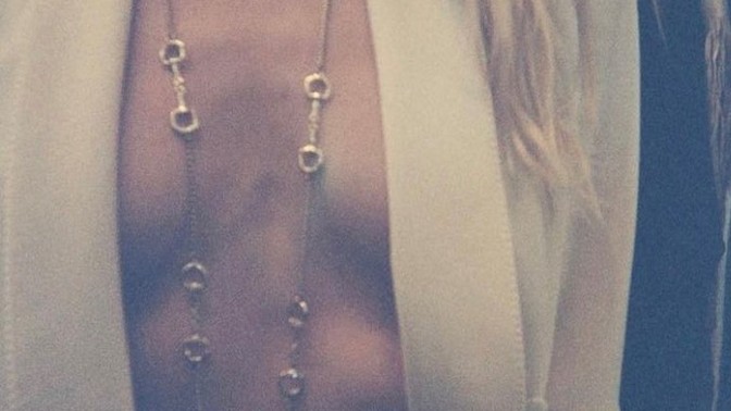 Do you think she is wearing anything underneath that jacket like pasties or anything like that?