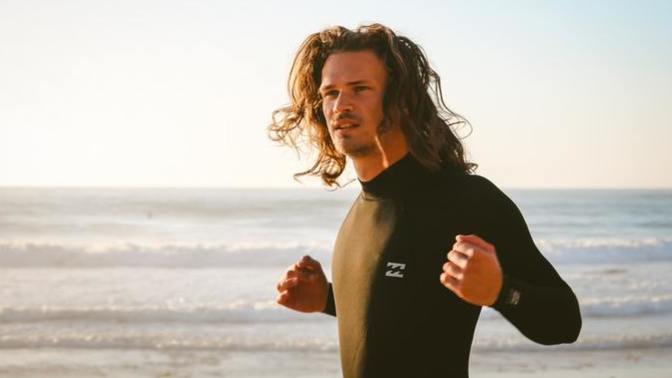 My boyfriend refuses to go shirtless at the beach. What can I do to boost his confidence?