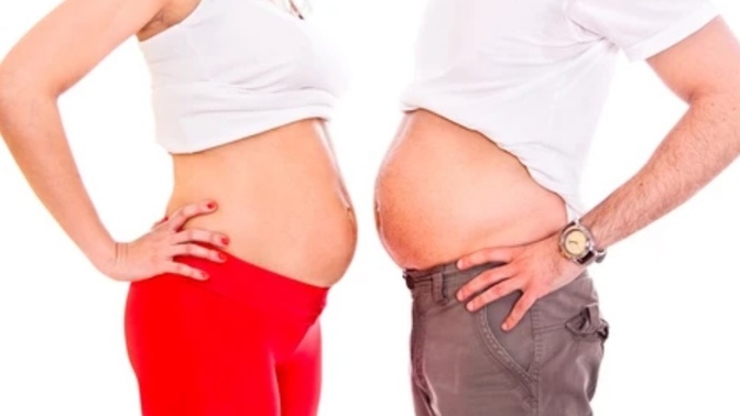 Why do a lot of men gain weight when their girlfriend or wife is pregnant?