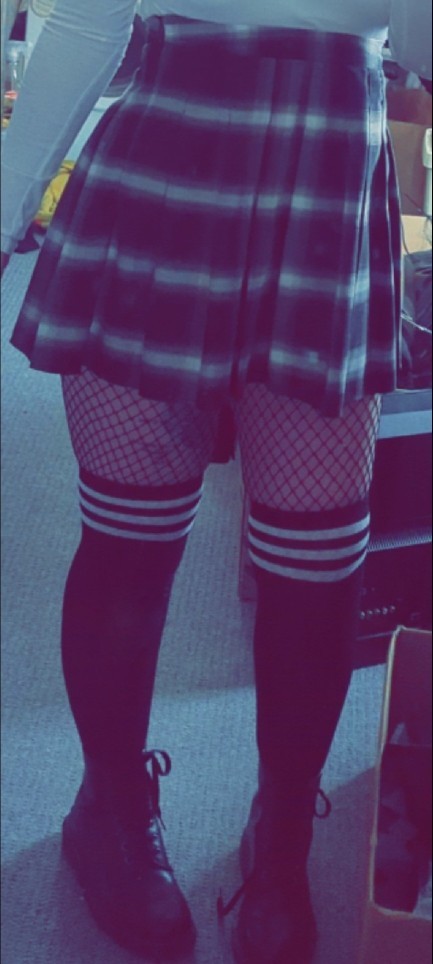 Do you like the combo of skirts, knee high, and fishnets?
