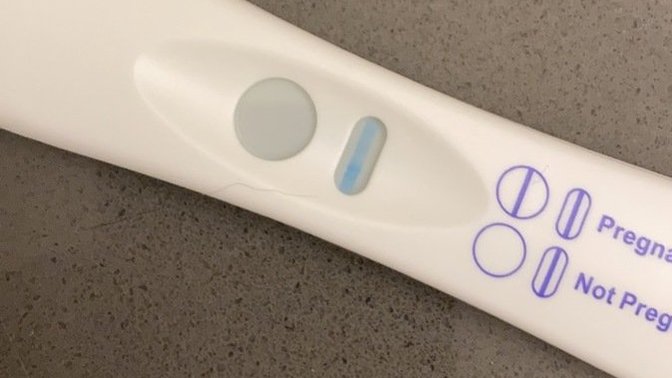 What does a faint control line on a pregnancy test mean?
