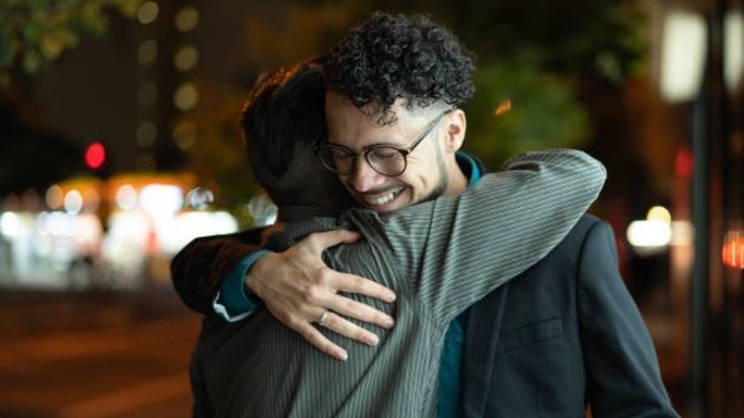 Is it ok for guy friends to hug each other?