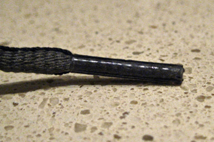 The thing on the end of a shoelace is called an AGLET.
