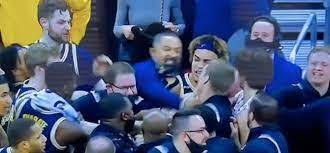 Juwan Howard (fab five) coach of Michigan punched another Coach on Wisconsin today after Basket ball game, what happens?